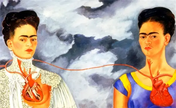 Les deux Fridas, deux portraits de l'artiste reliés par une artère, l'une en robe victorienne, l'autre en tenue colorée.